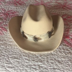 White cowboy hat with feather band